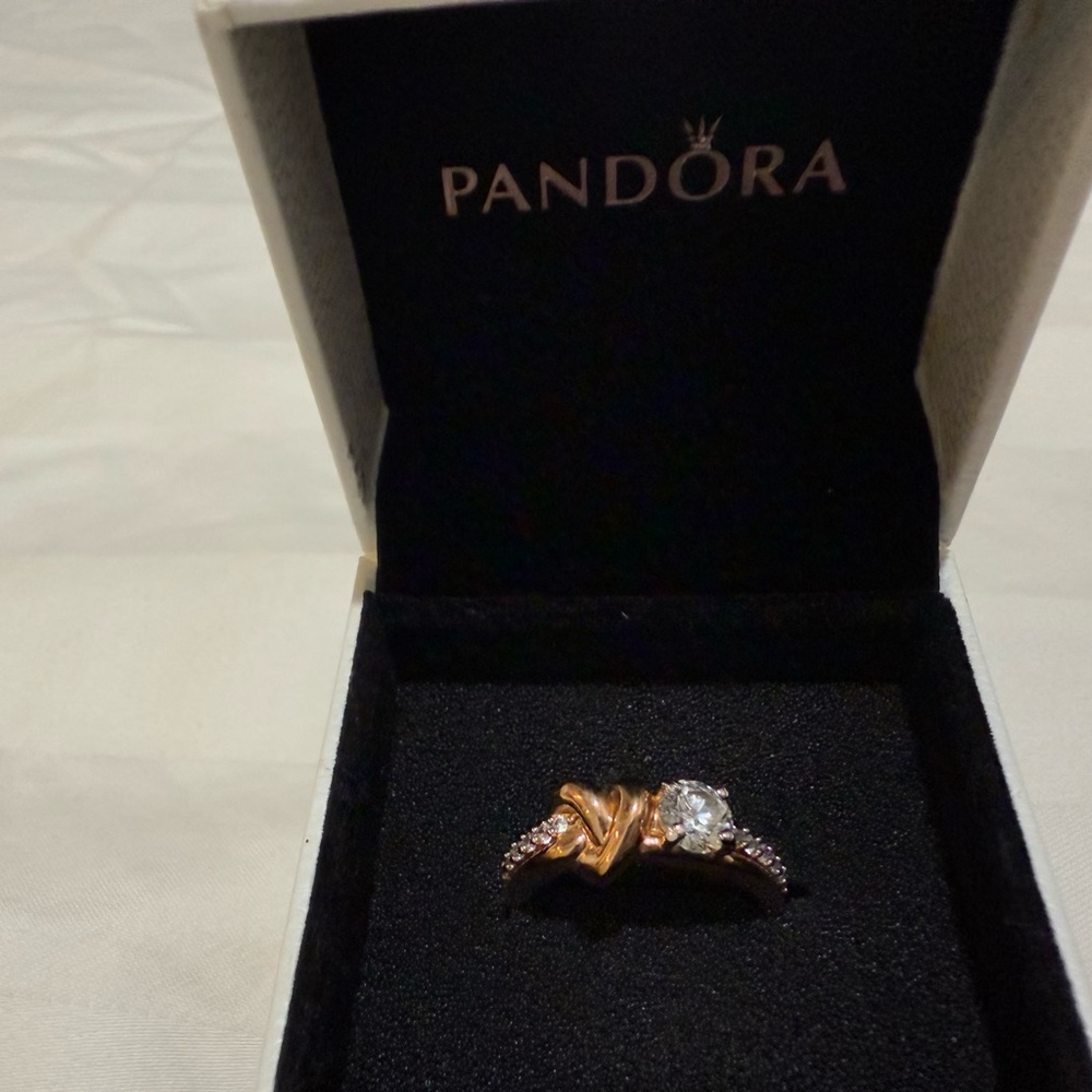 Pandora Gold metal and 
 crystals. Gemstone and heart in the middle
